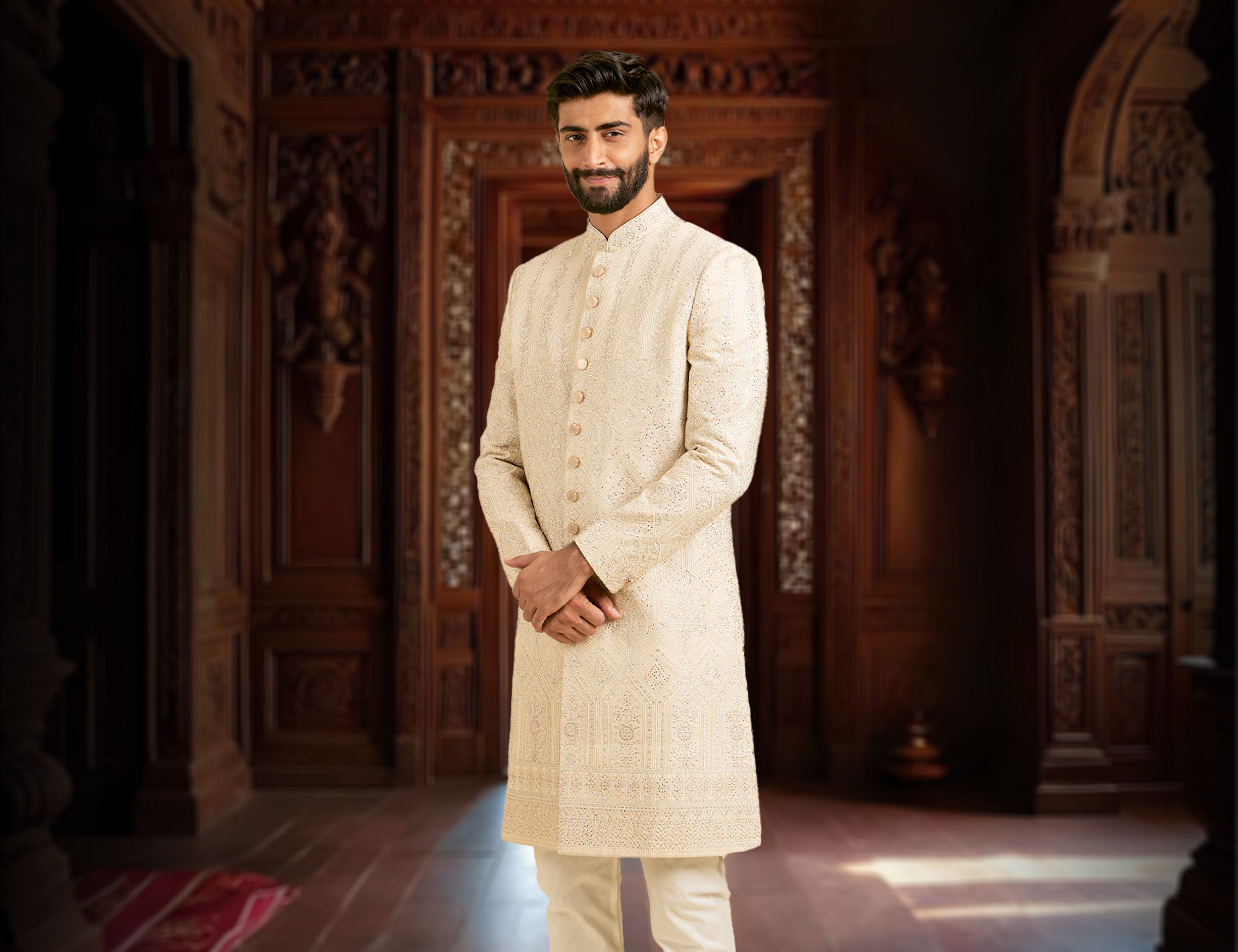 A groom wearing The classic white sherwani